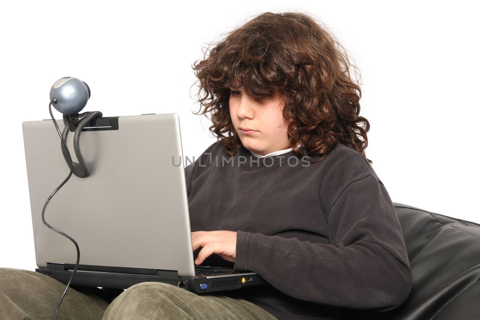 boy using laptop and webcam on white background