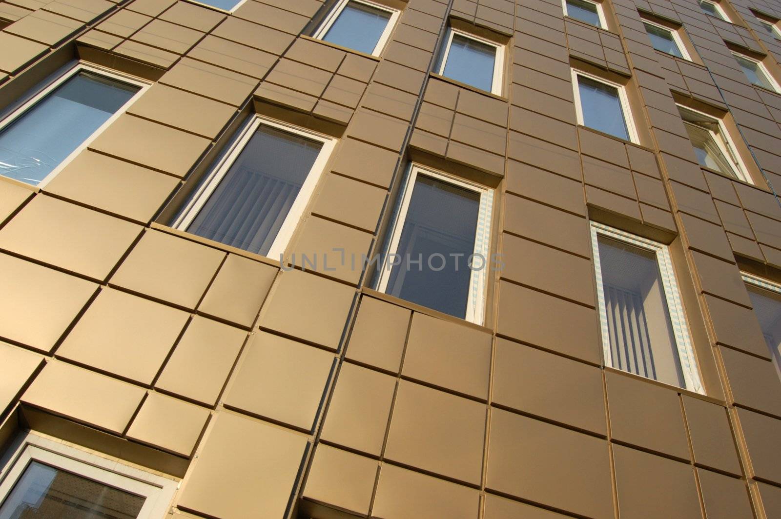 modern office building over blue sky with clouds