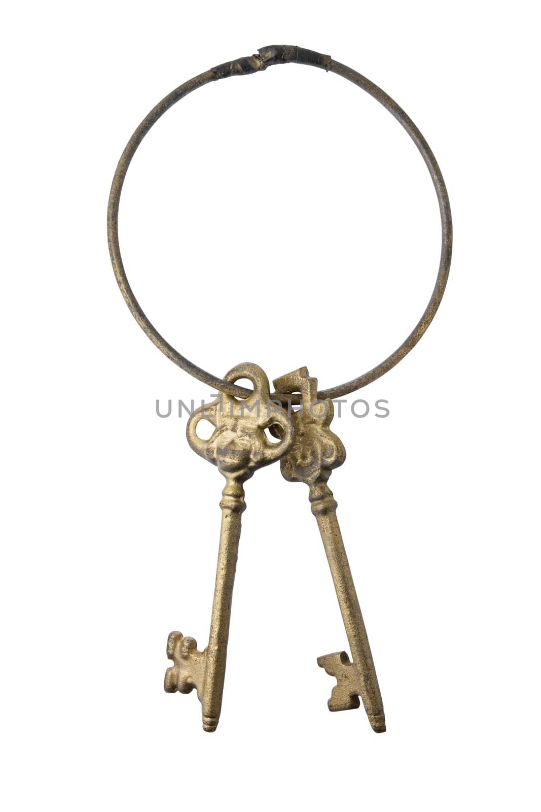 Two antique golden keys on a keychain isolated on white background with clipping path