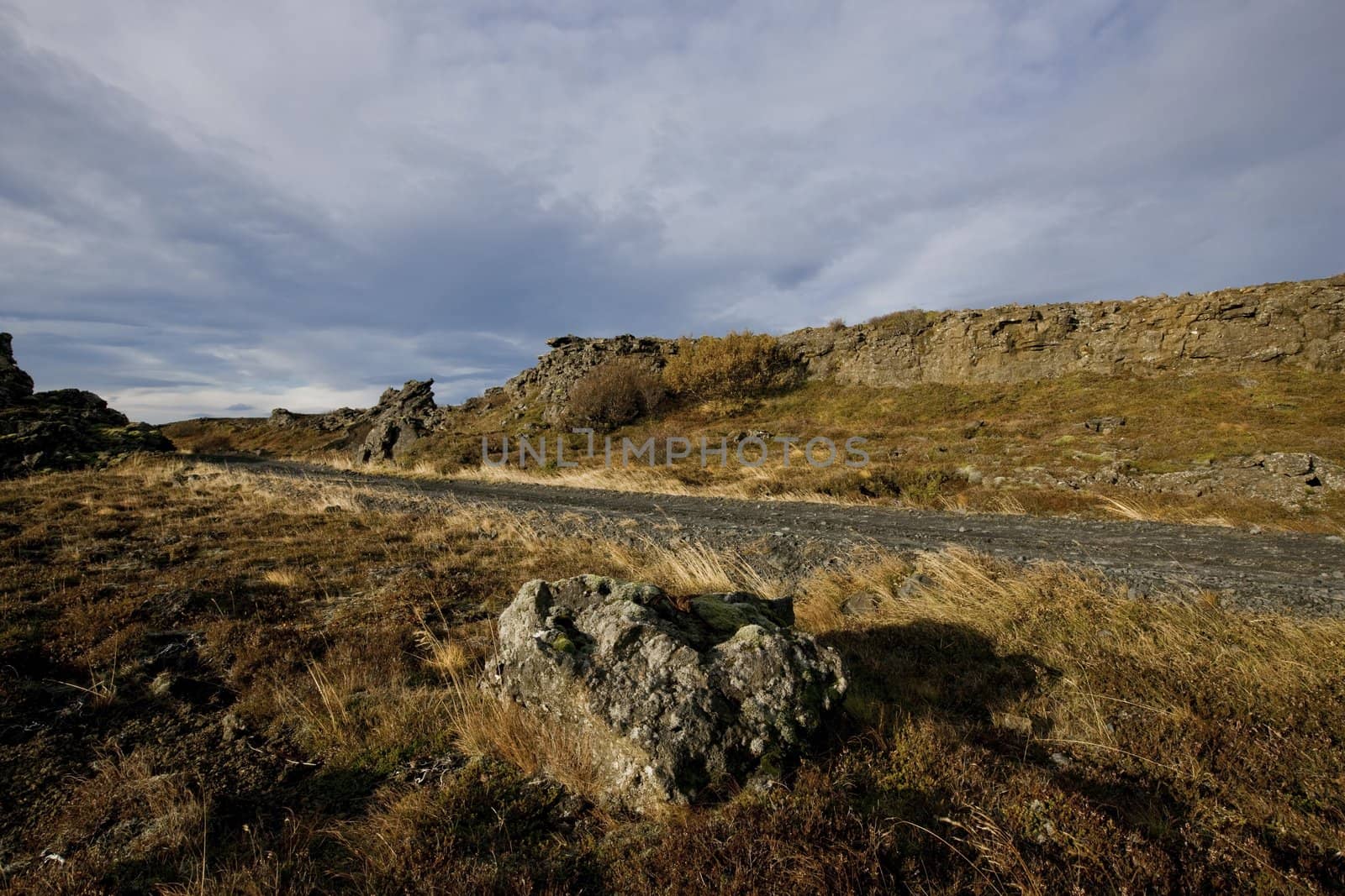 Isolated road going through barren mountainous landscape