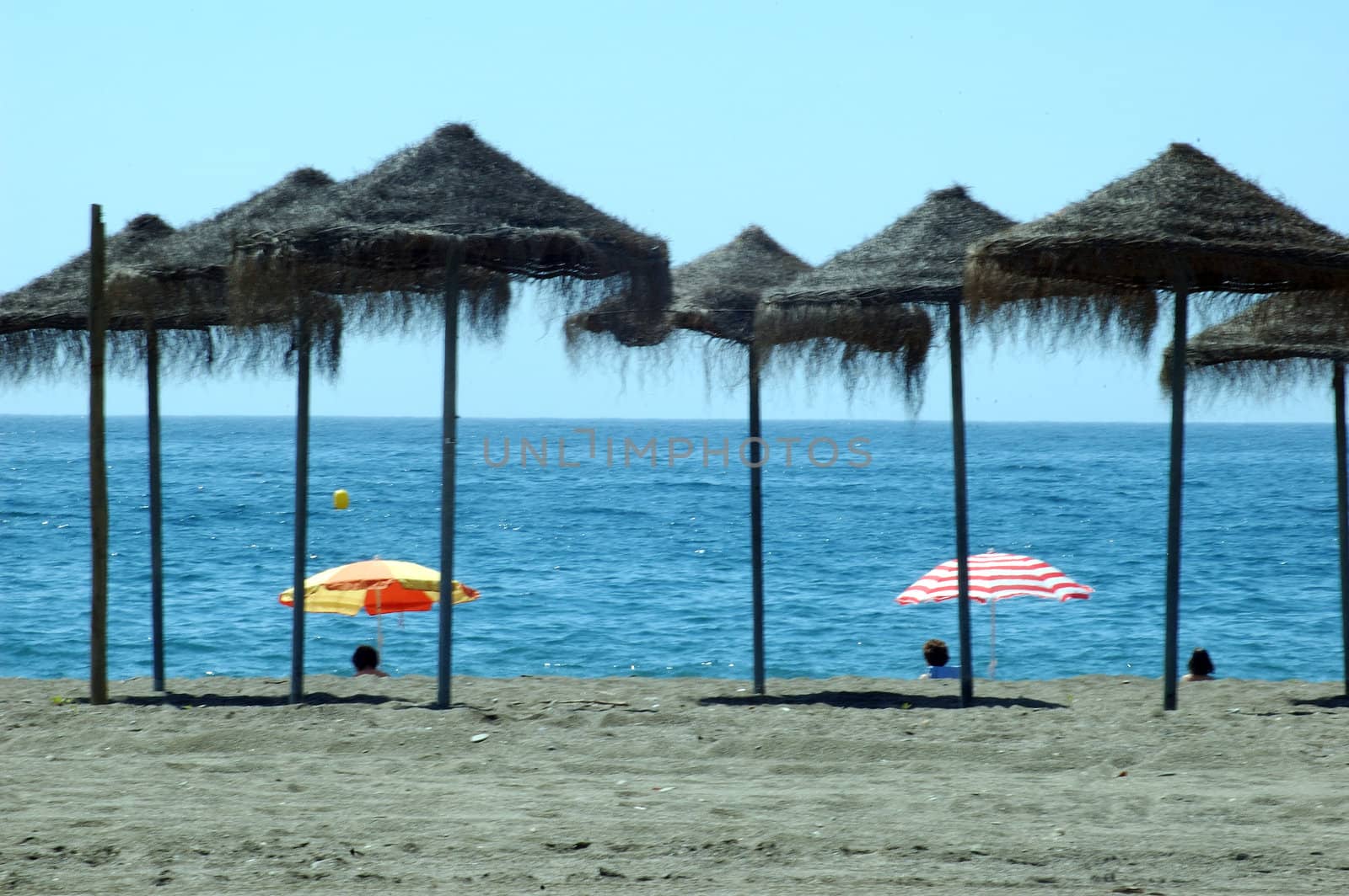 Beach with umbrellas in Andalusia, Spain