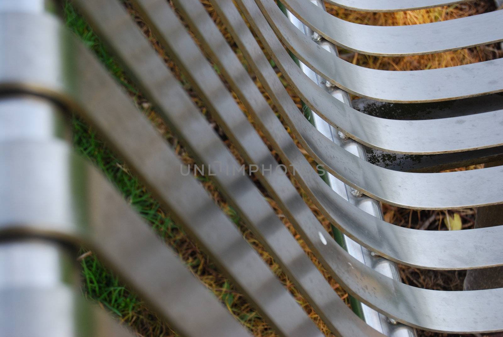 Closeup of a metallic bench with shallow depth of field