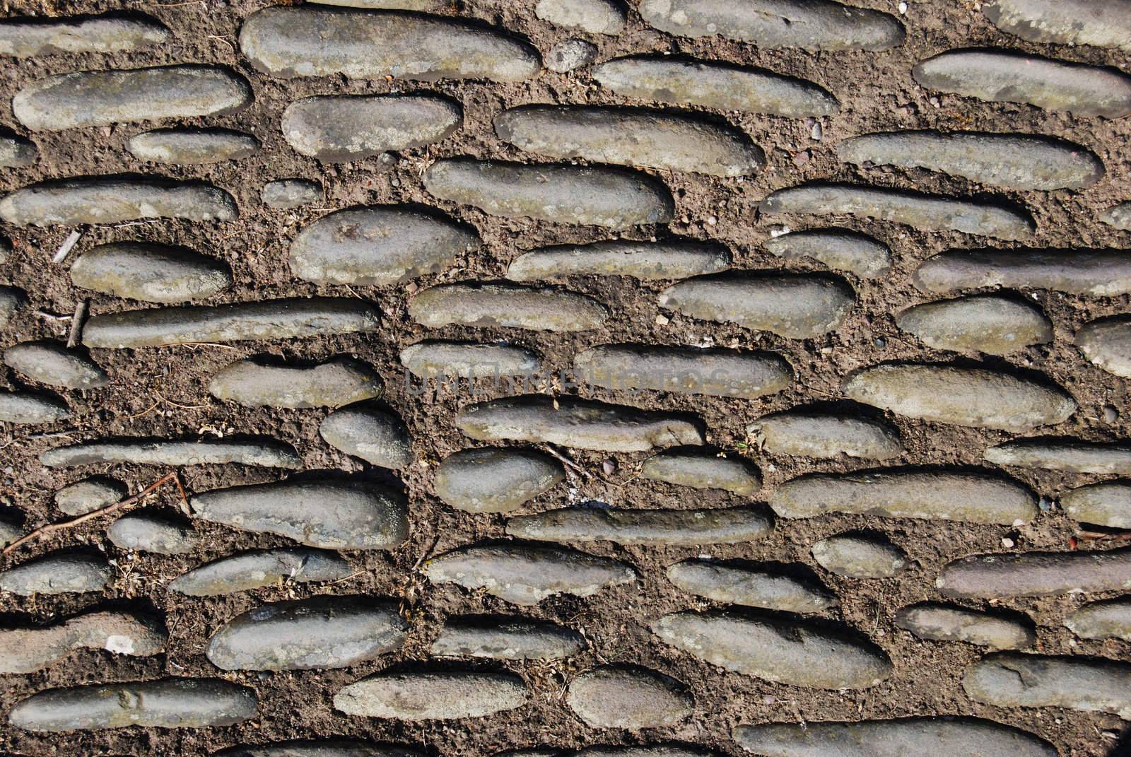 abstract of a pavement made out of concrete and stones