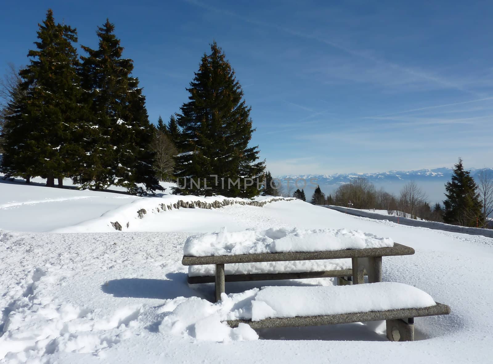 Table and benches in the mountain by winter by Elenaphotos21