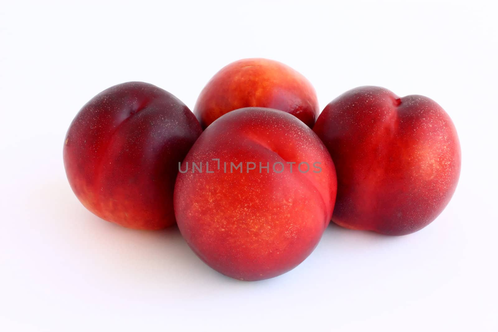 Fresh, colorful ripe nectarines, isolated