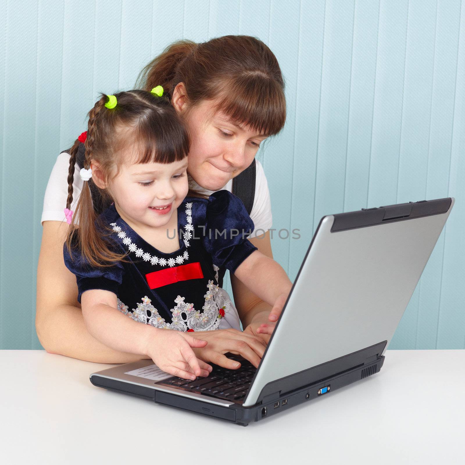 Mom teaches daughter to use laptop by pzaxe