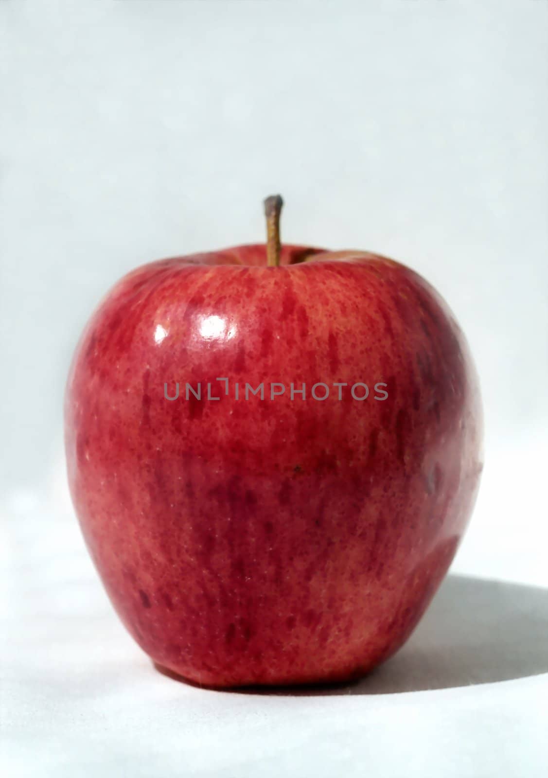 Big red apple in high key