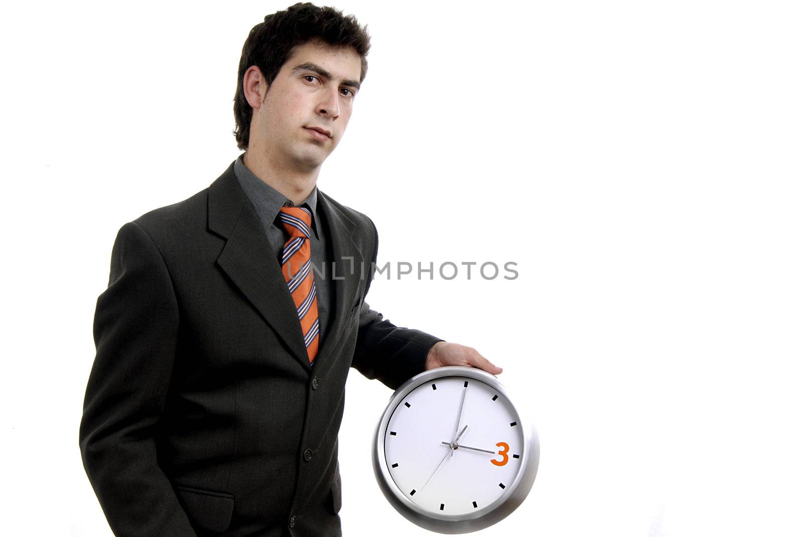 young handsome business man holding a clock