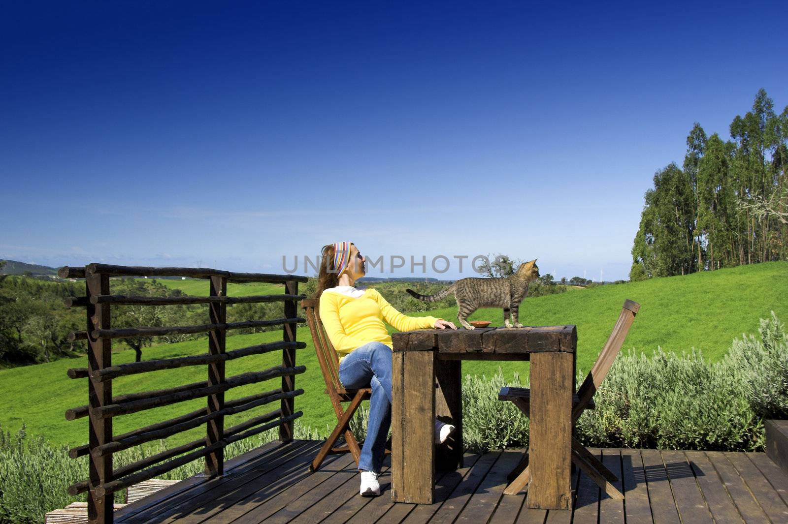 Young woman enjoying the nature with a small friend as company