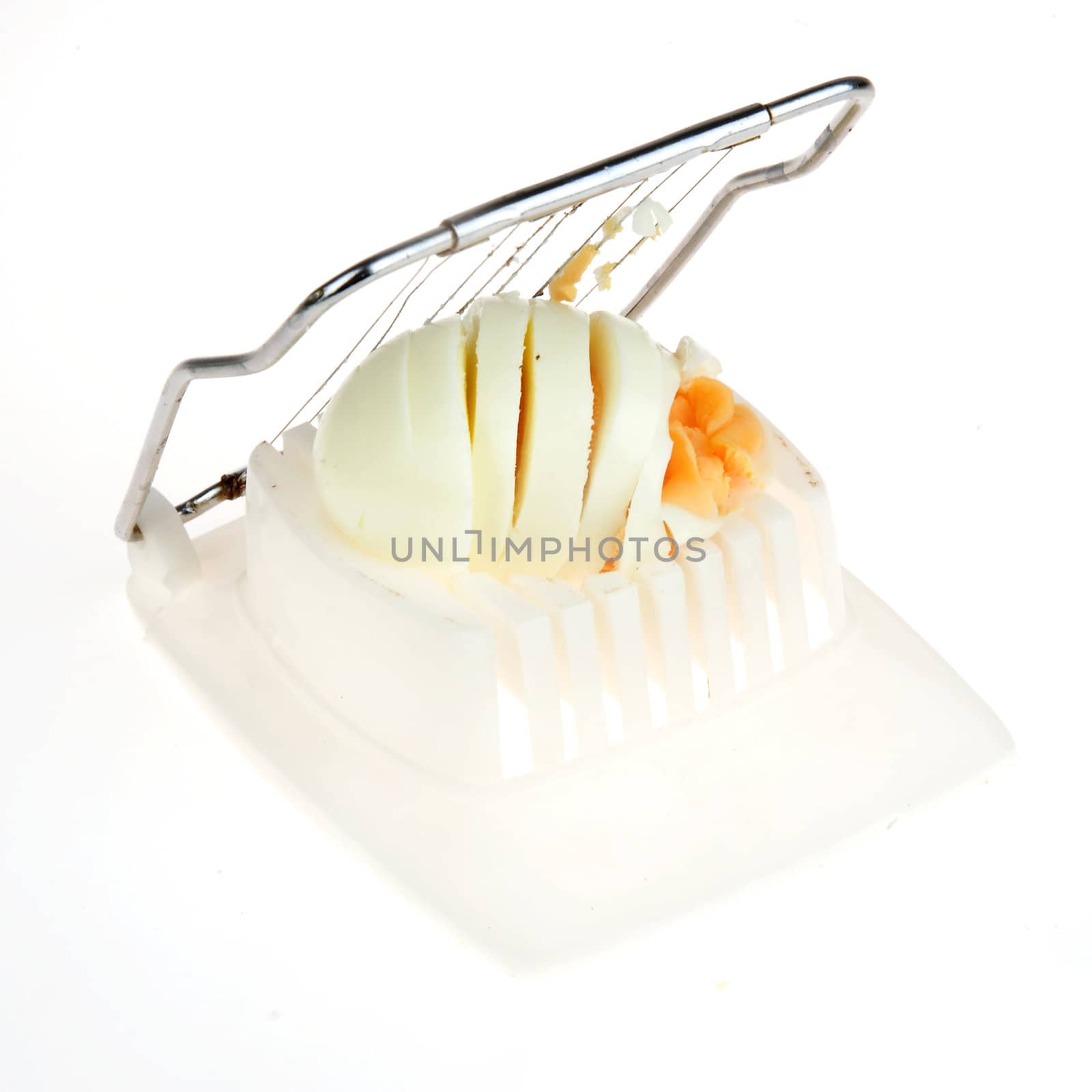 a boiled egg in a egg-cutter