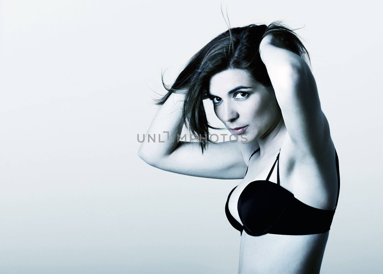 Glamour Portrait of a beautiful young woman - toned in blue