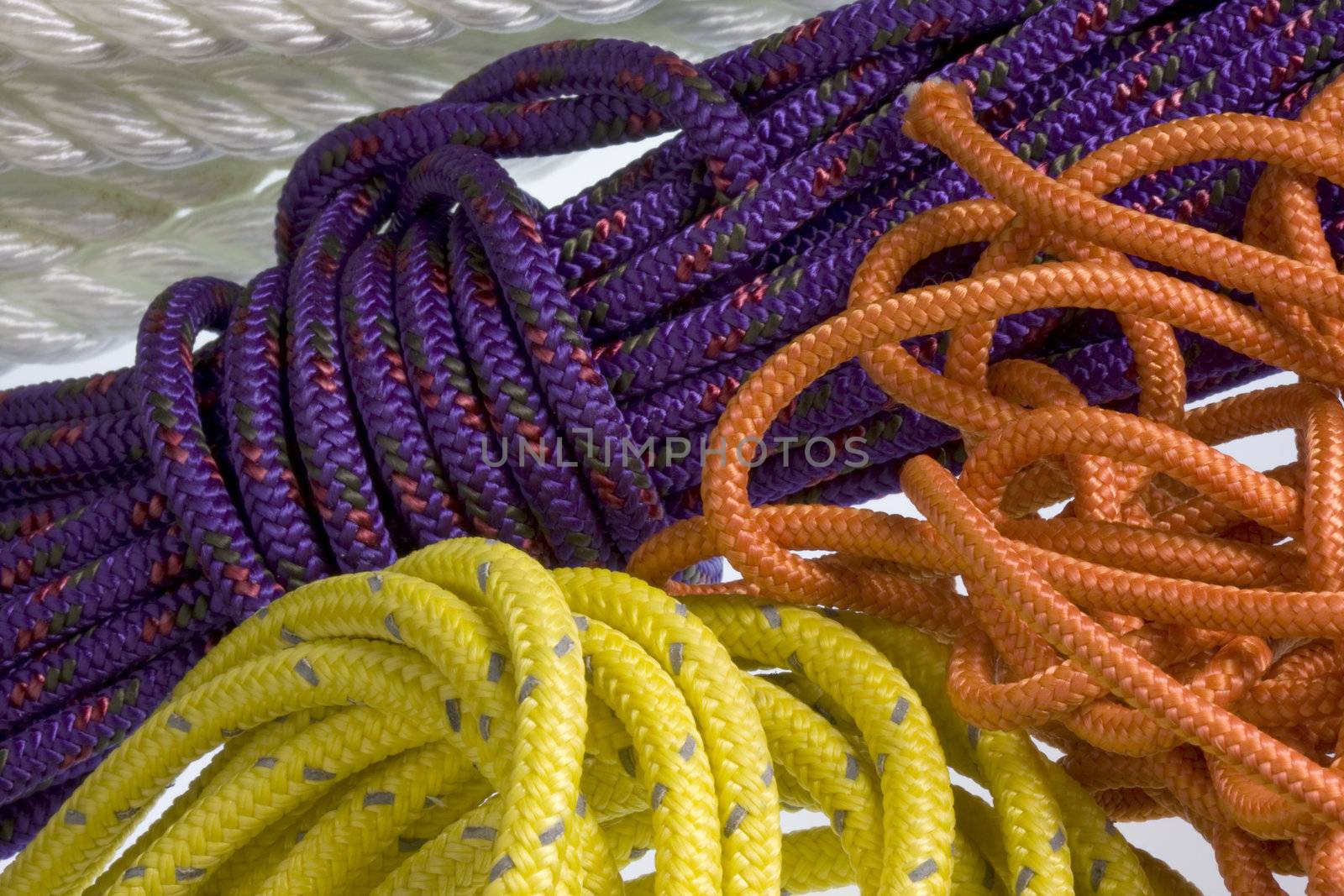background of colorful, nylon ropes and cords coiled and chaotic