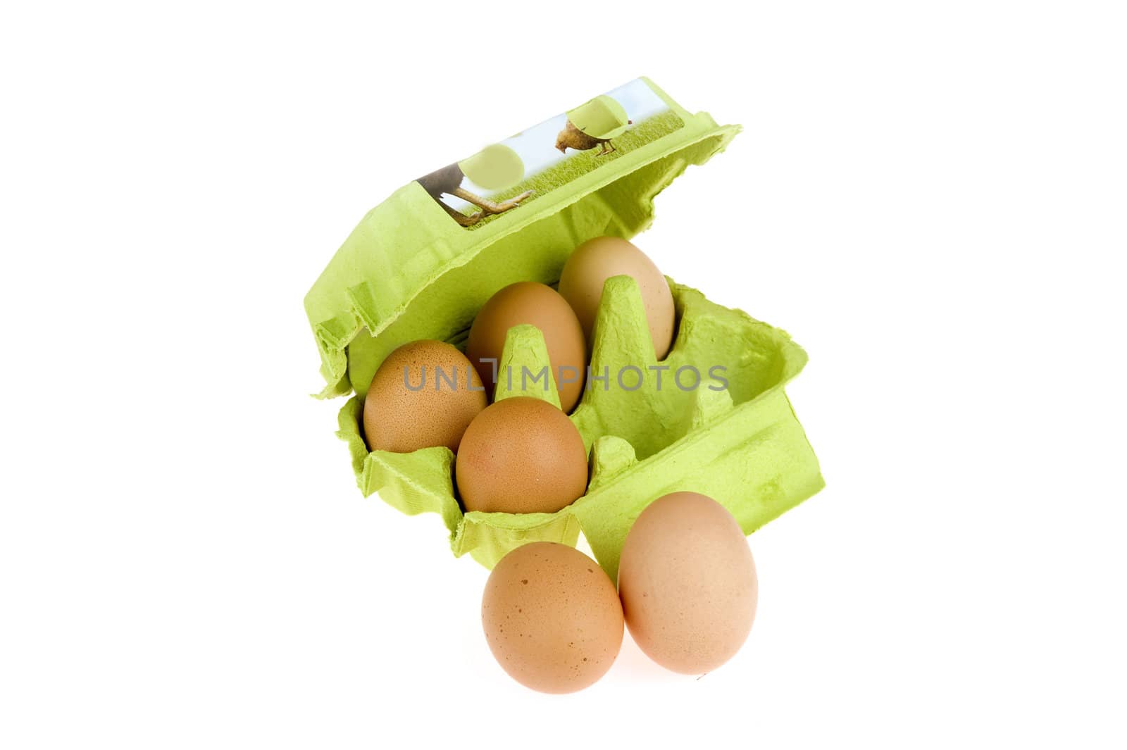 four eggs in a green box and two in front of the box