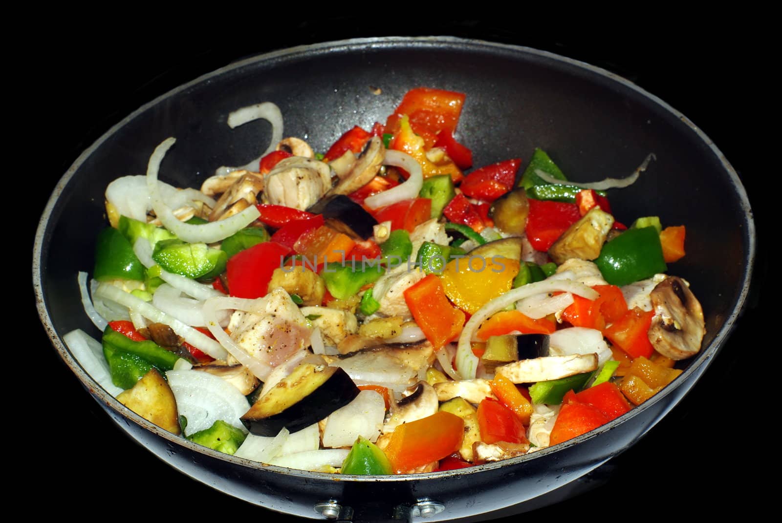 meat and different vegetables on black background