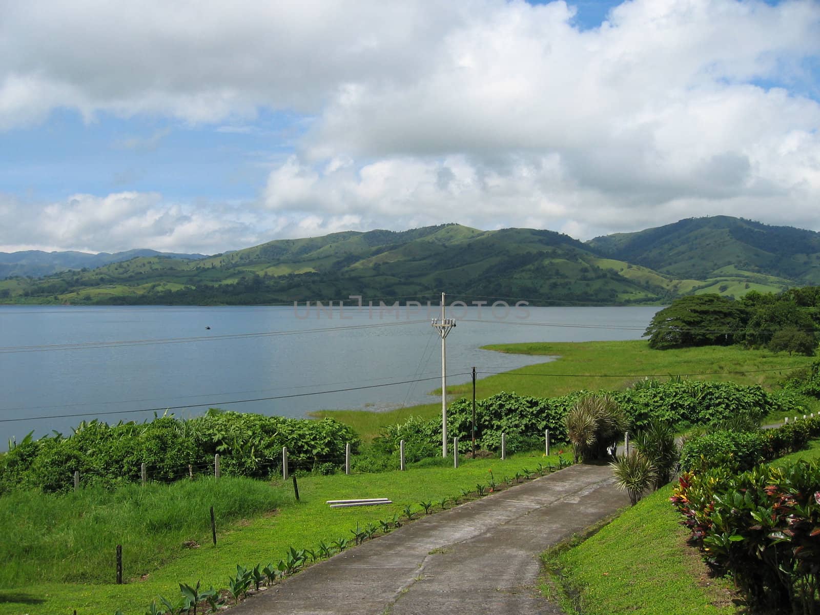 road to a nice paradise on the coast with green hill