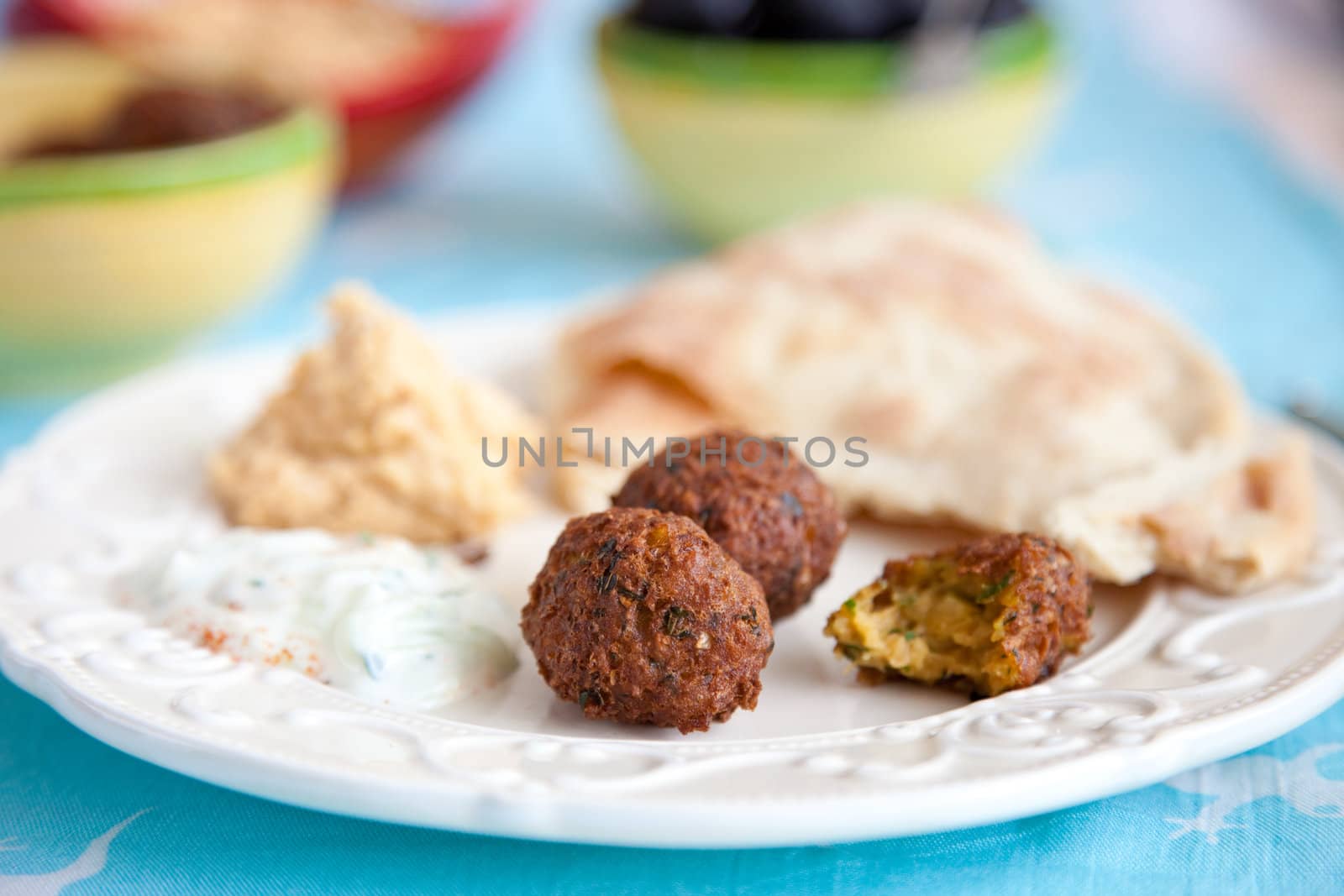 Falafel and mezze table by Fotosmurf