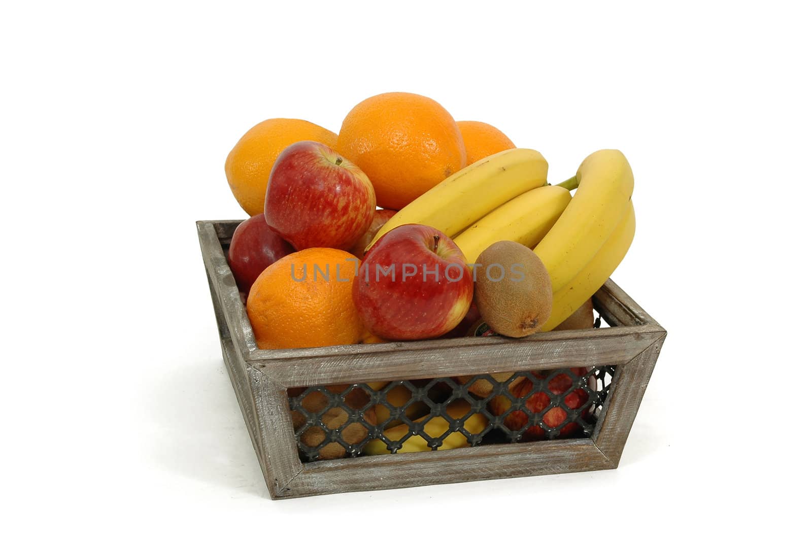 Fruit basket on a white background. The basket is made out of wood.