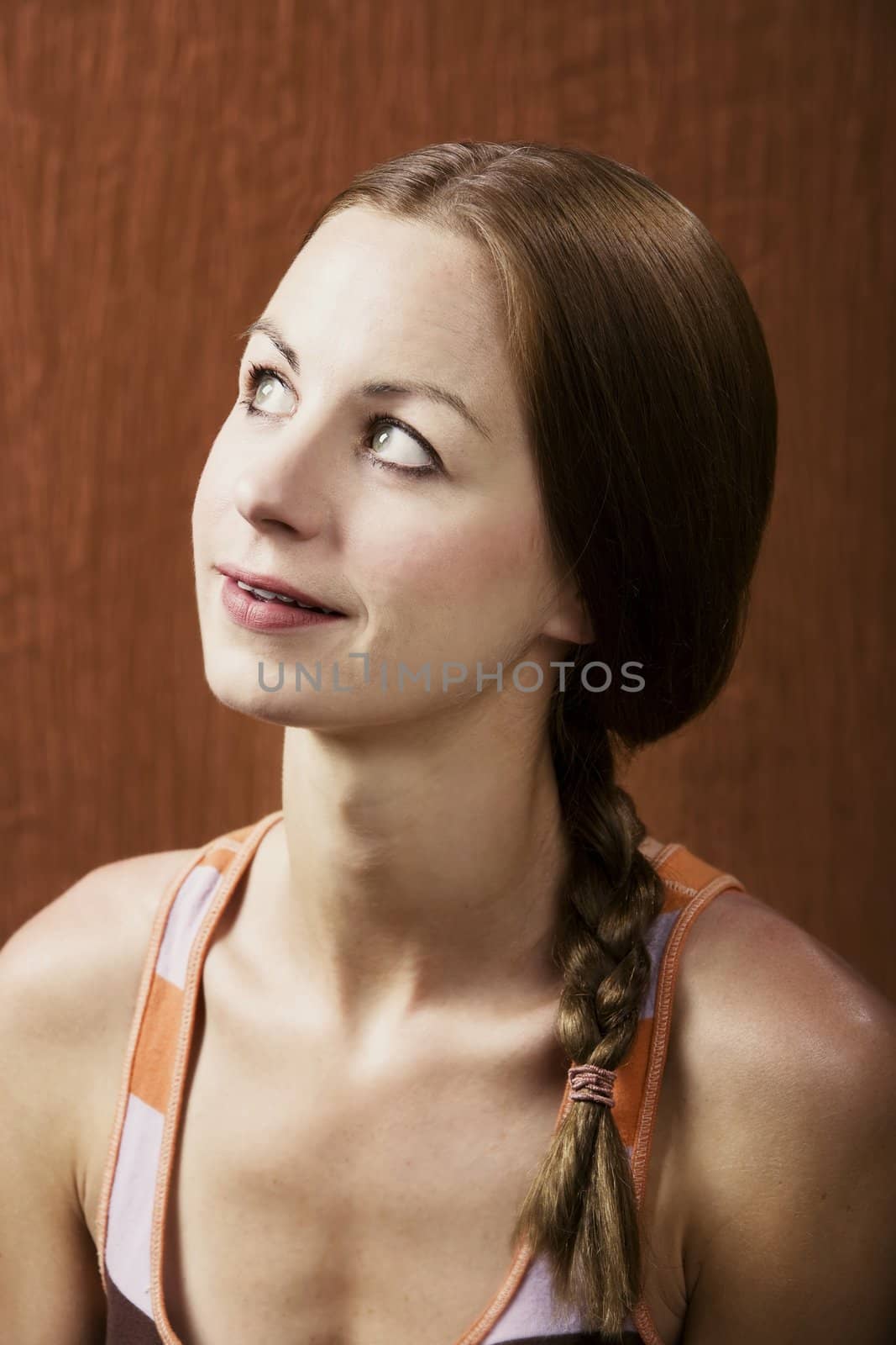 Closeup Portrait of an Attractive Young Woman Looking Up