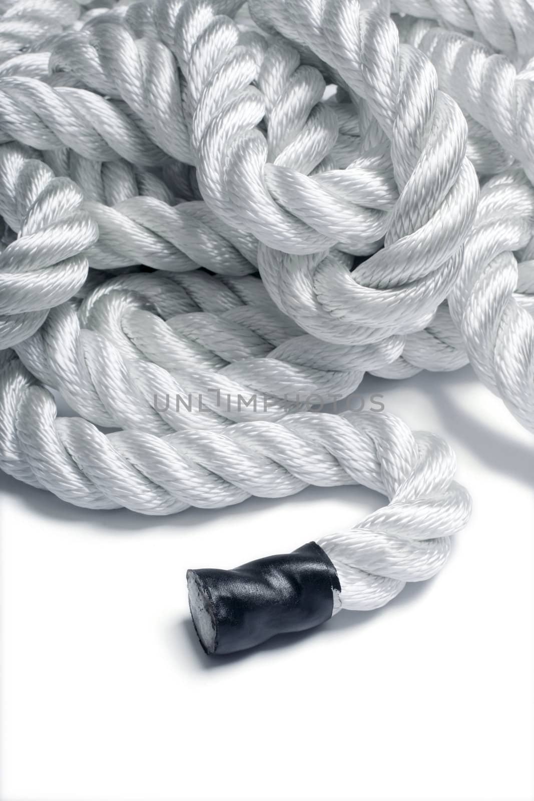 Detail of a twisted nylon rope focus on the end