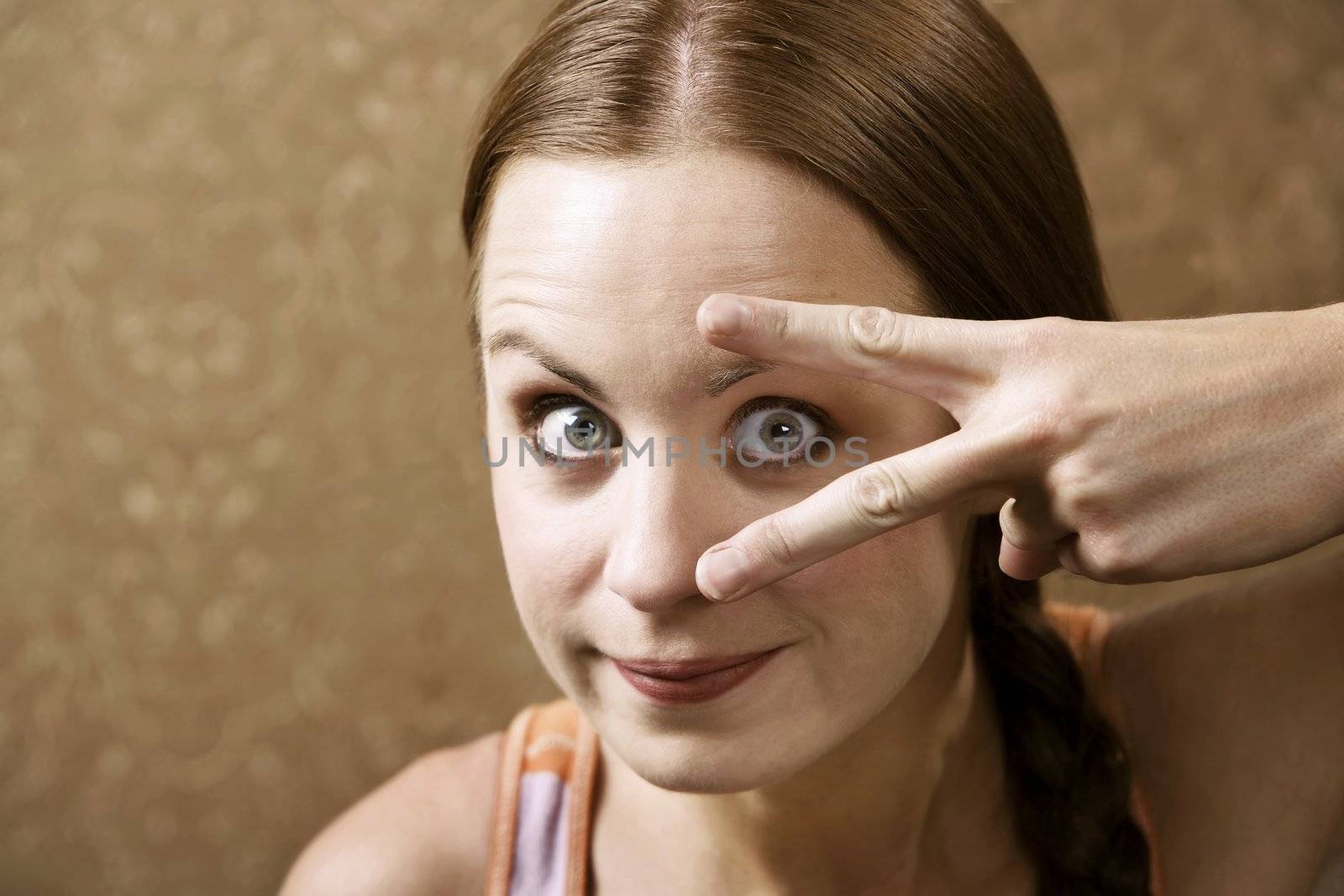 Funny Woman Peeking Out From Between Her Fingers