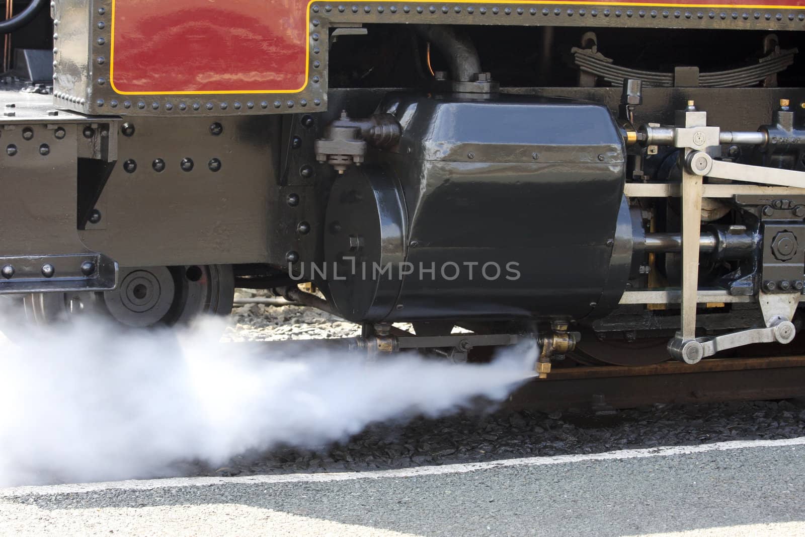 Steam train venting steam Aberystwyth Wales on its way to Devils Bridge