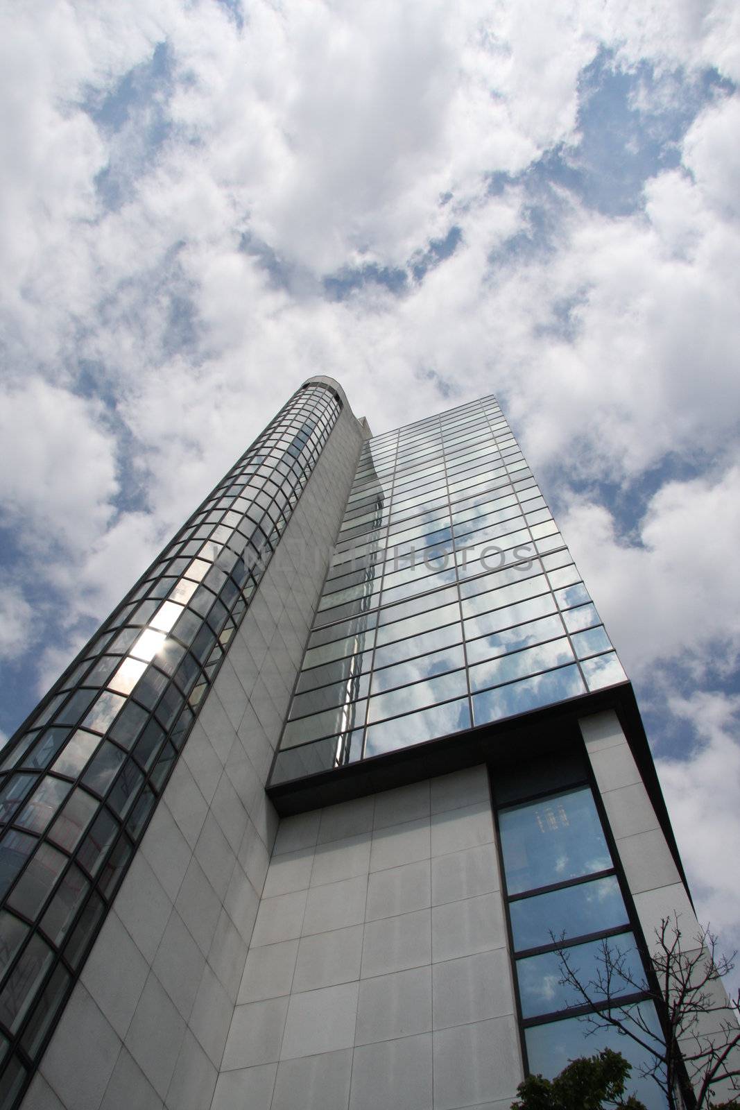 Mirrored high rise office block looking up into the sky Cardiff Wales UK