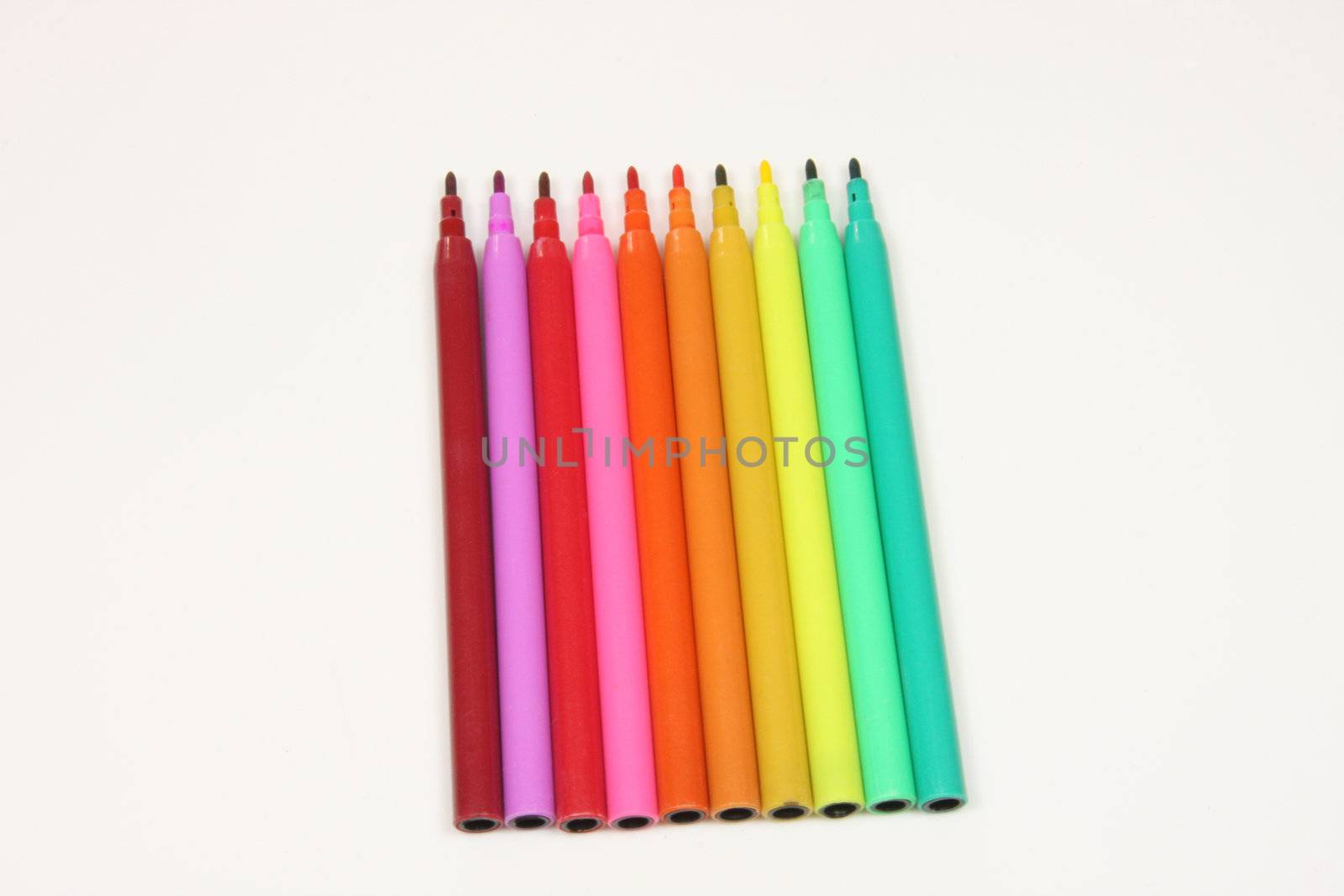 Coloured or colored felt tip pens in a colour spectrum isolated on a white background