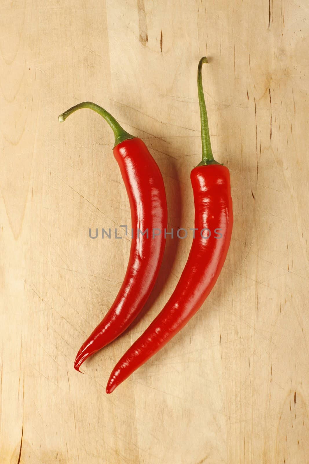 Red hot chilli peppers on a cutting board