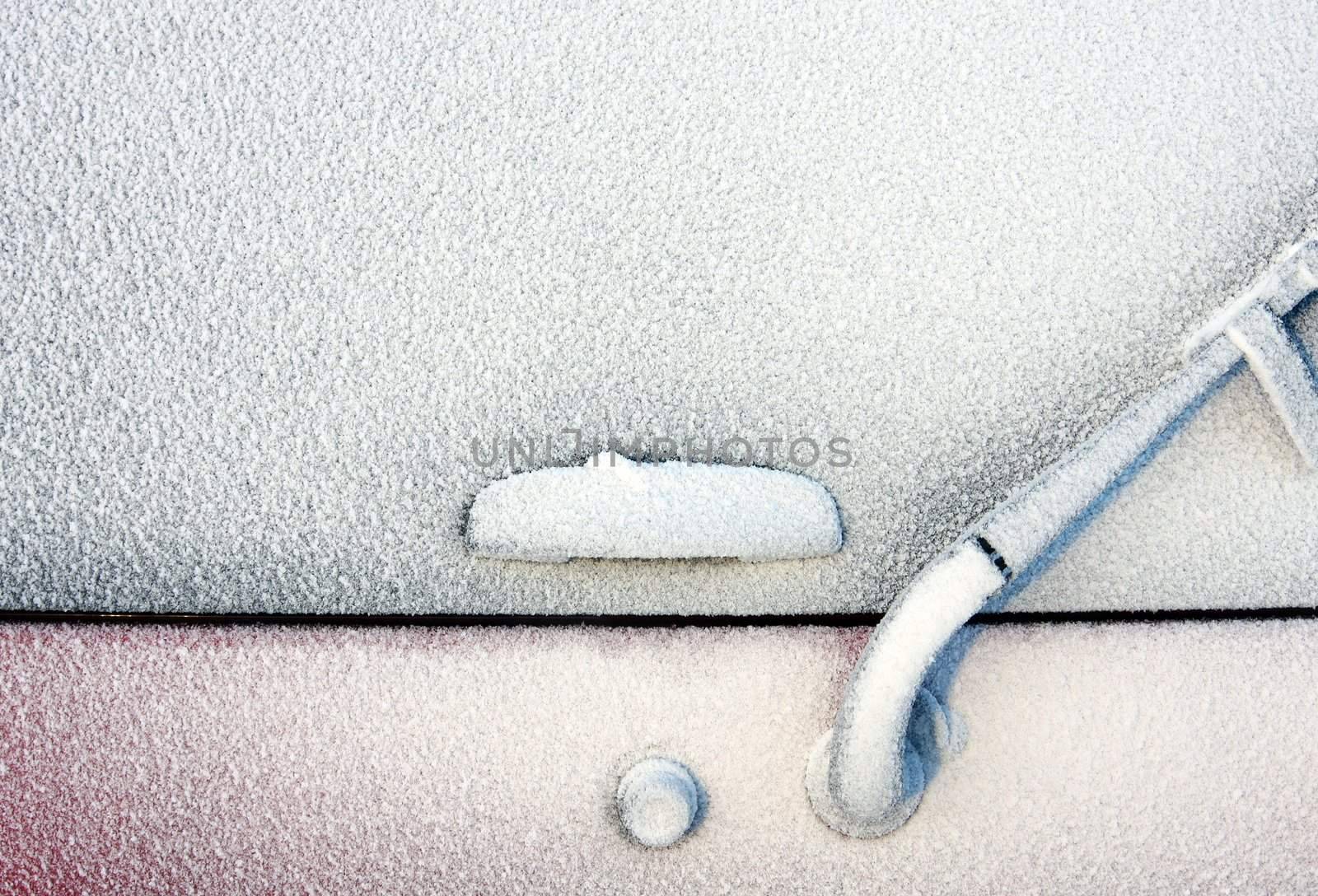 Backside of a 4x4 completely covered with frost after a winter blizzard