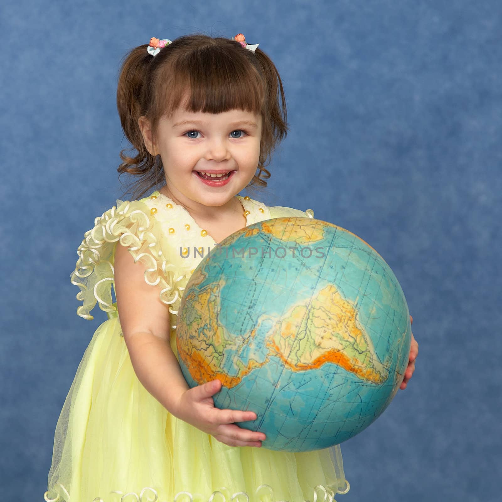 Beautiful little girl with globe by pzaxe