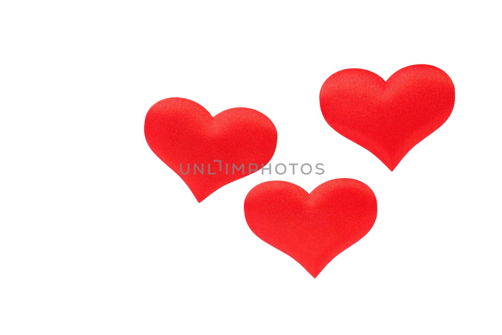 Three red hearts, isolated on a white background.