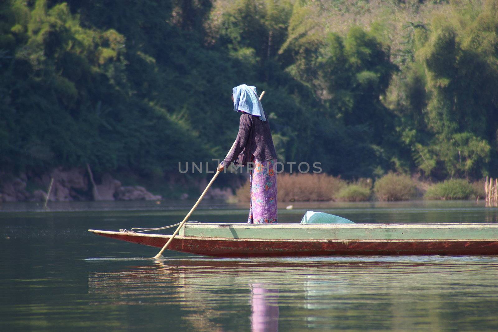 Asian woman in a canoe