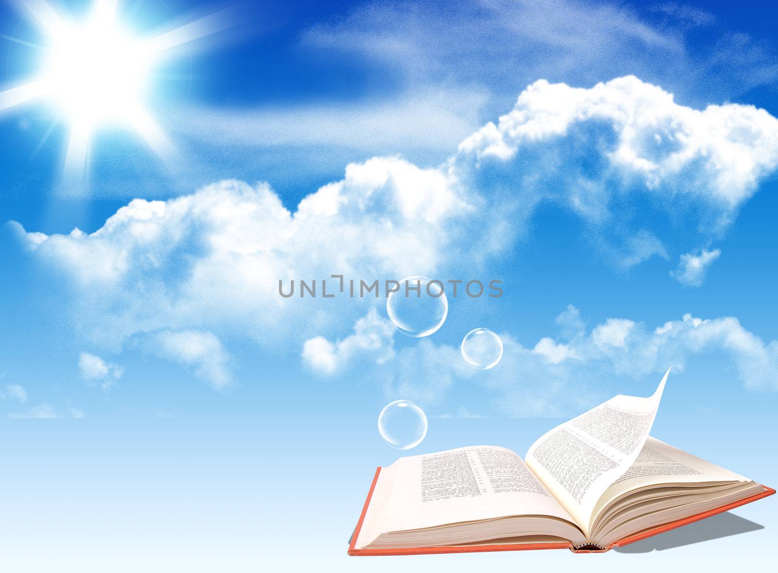 Opened book under the blue sky background