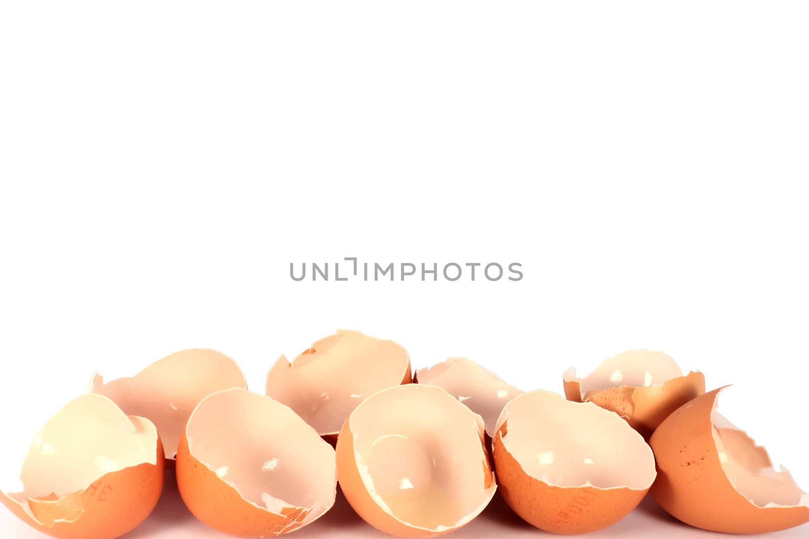 Broken egg shells on white background