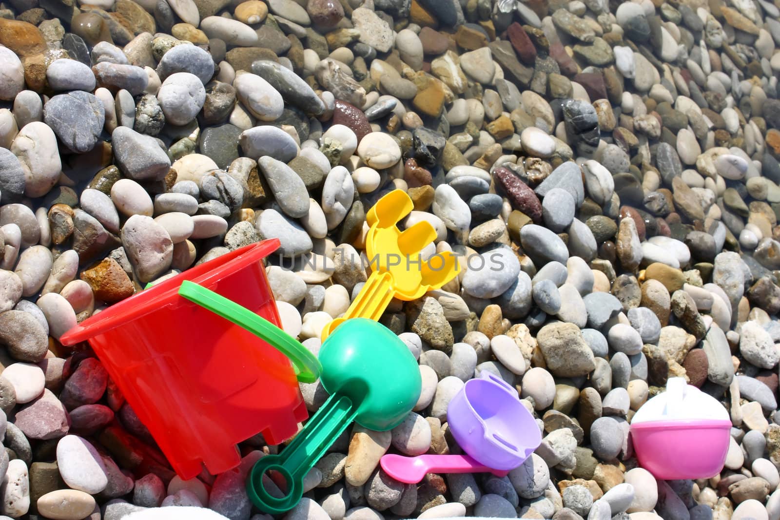 child toys on the pebble beach