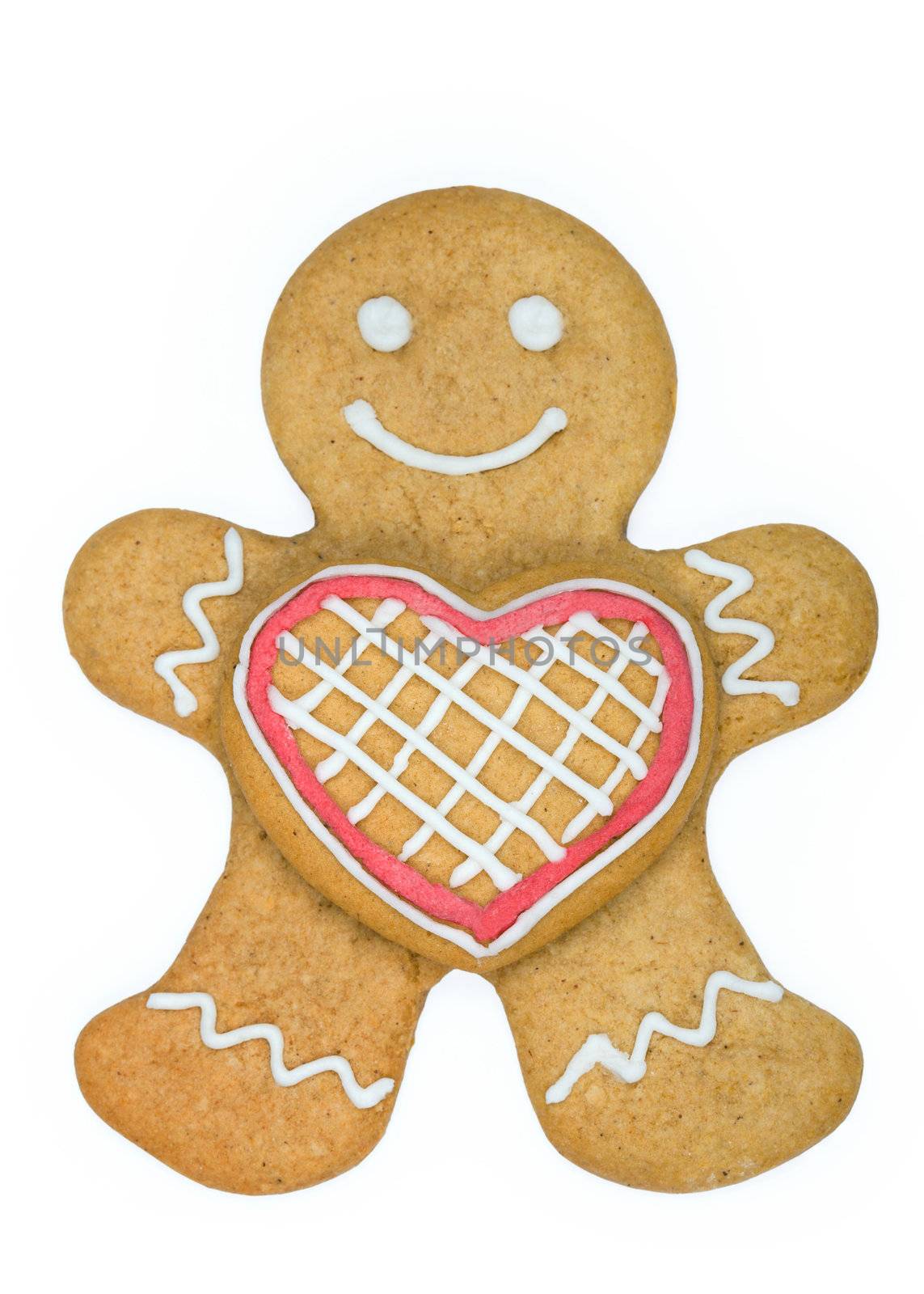 Gingerbread man holding a heart shaped cookie