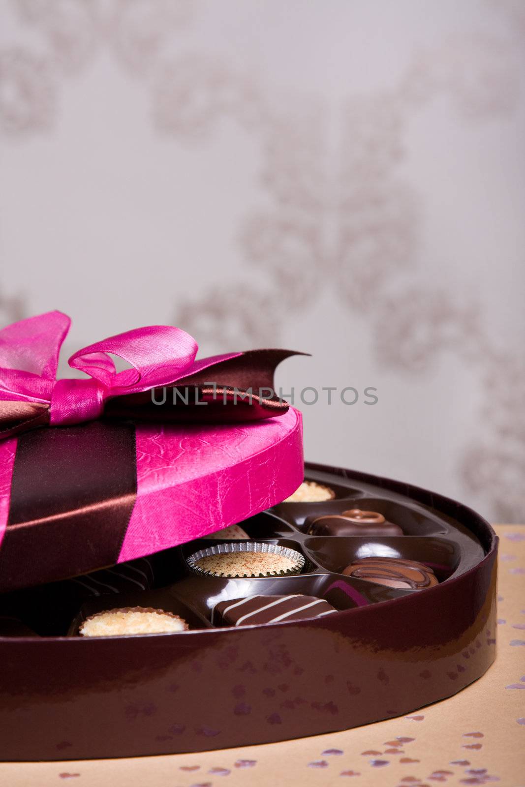 Luxury chocolates with a pink satin lid