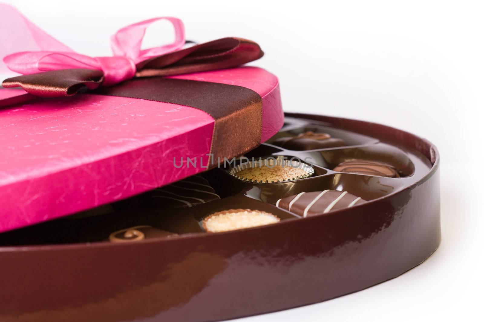 Gourmet chocolates tied with a pink ribbon