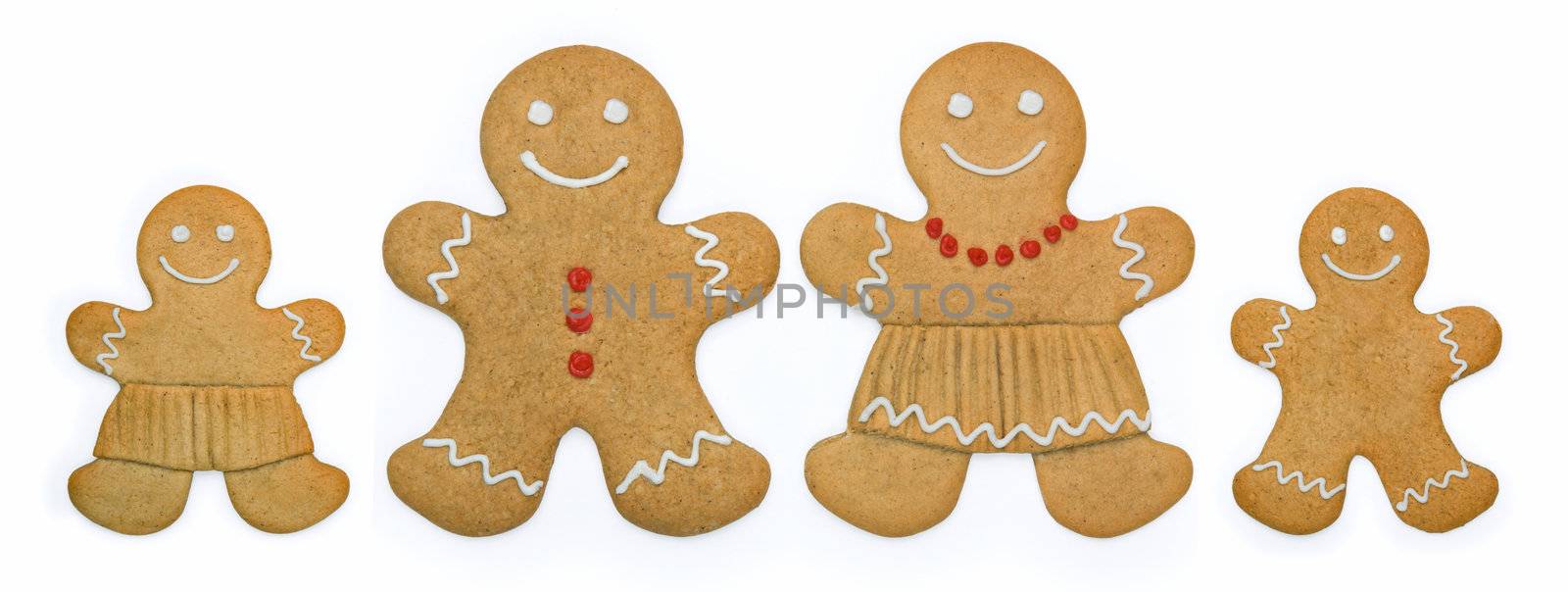 Smiling gingerbread family stand in a row