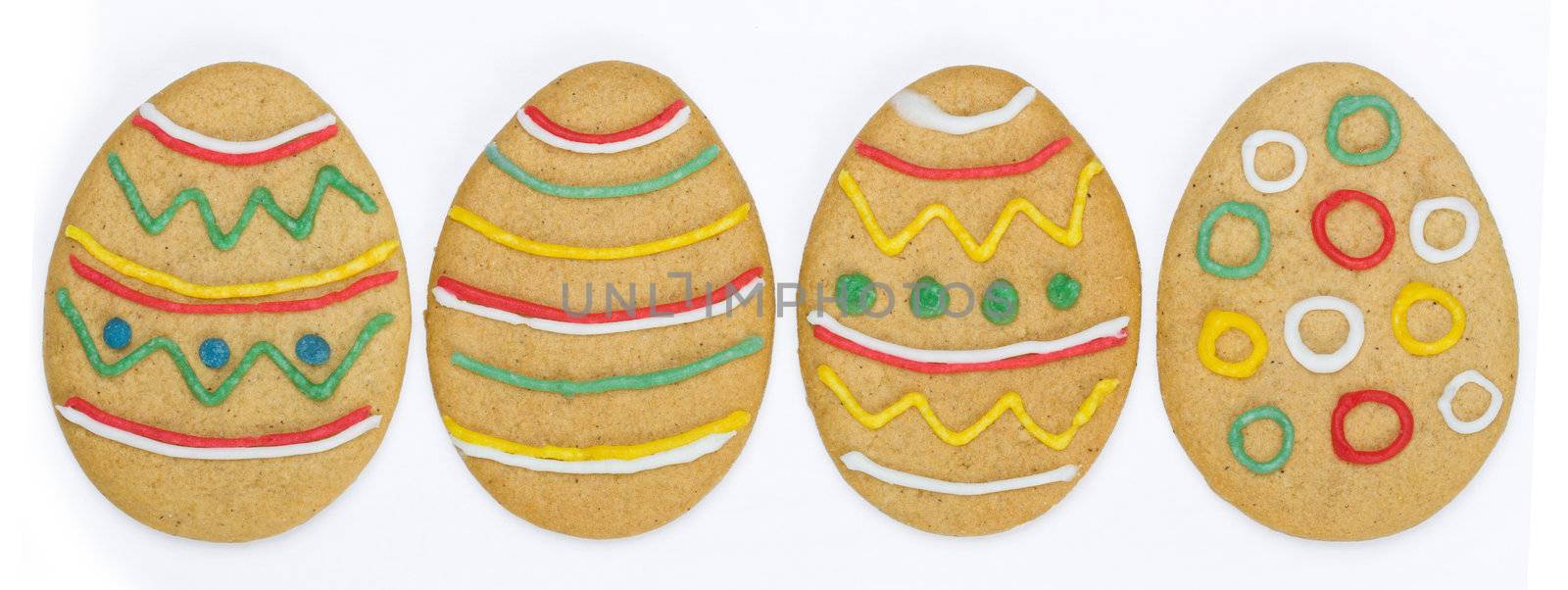Row of colourful easter cookies against white