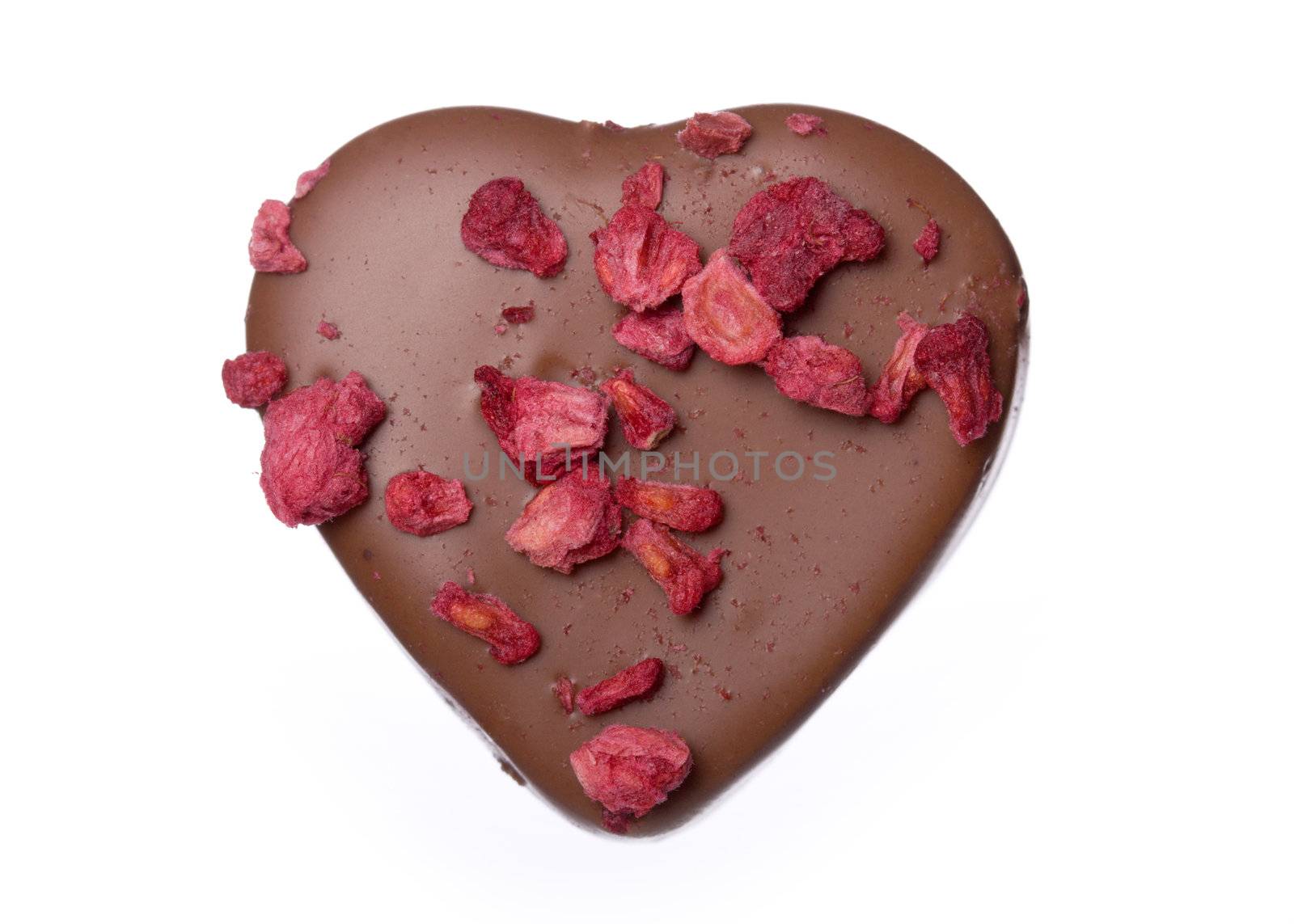 Single chocolate decorated with dried raspberry pieces