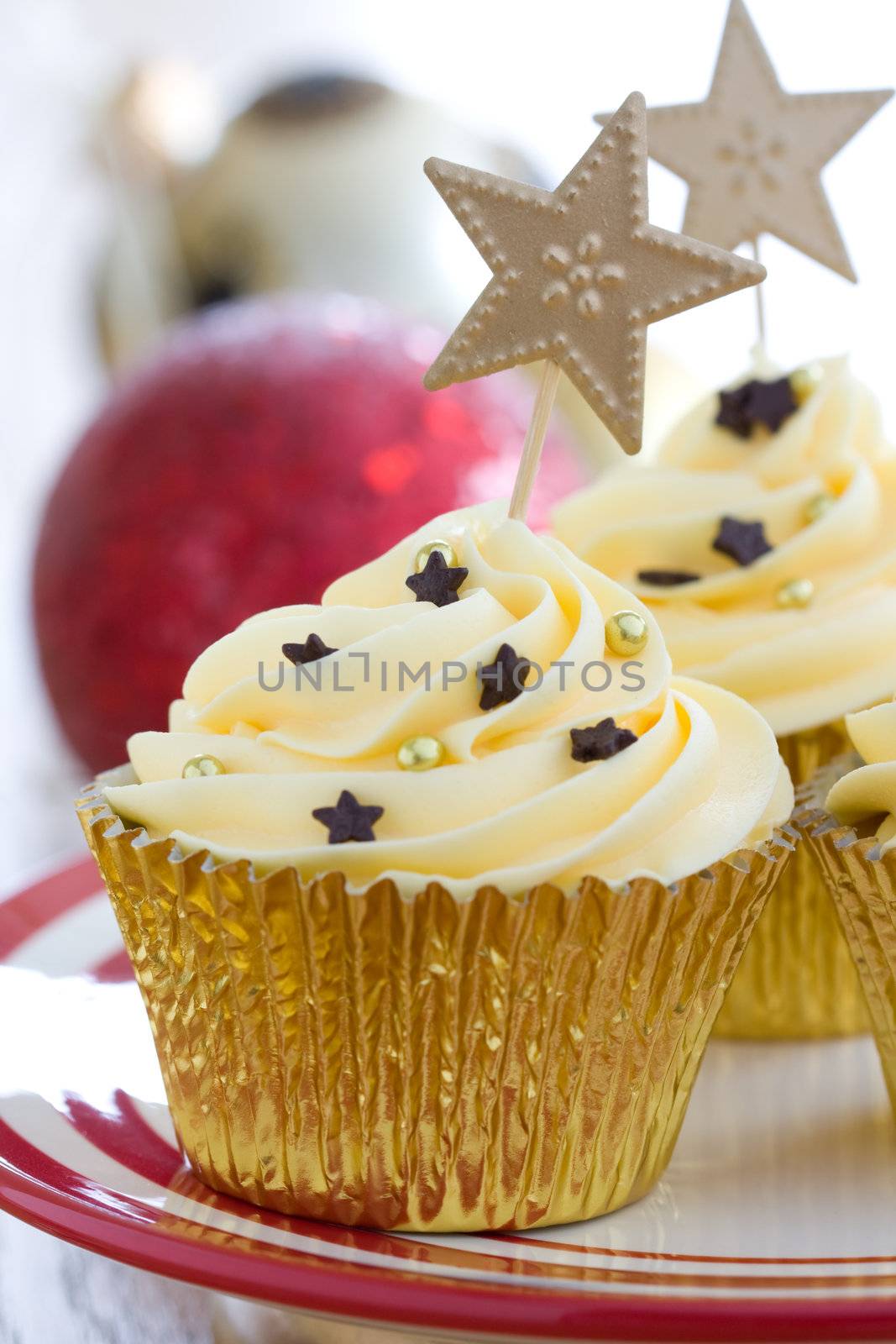 Golden cupcake with Christmas baubles