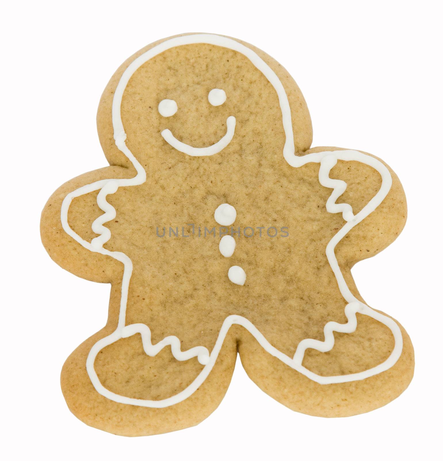 Gingerbread man decorated with white icing isolated against white