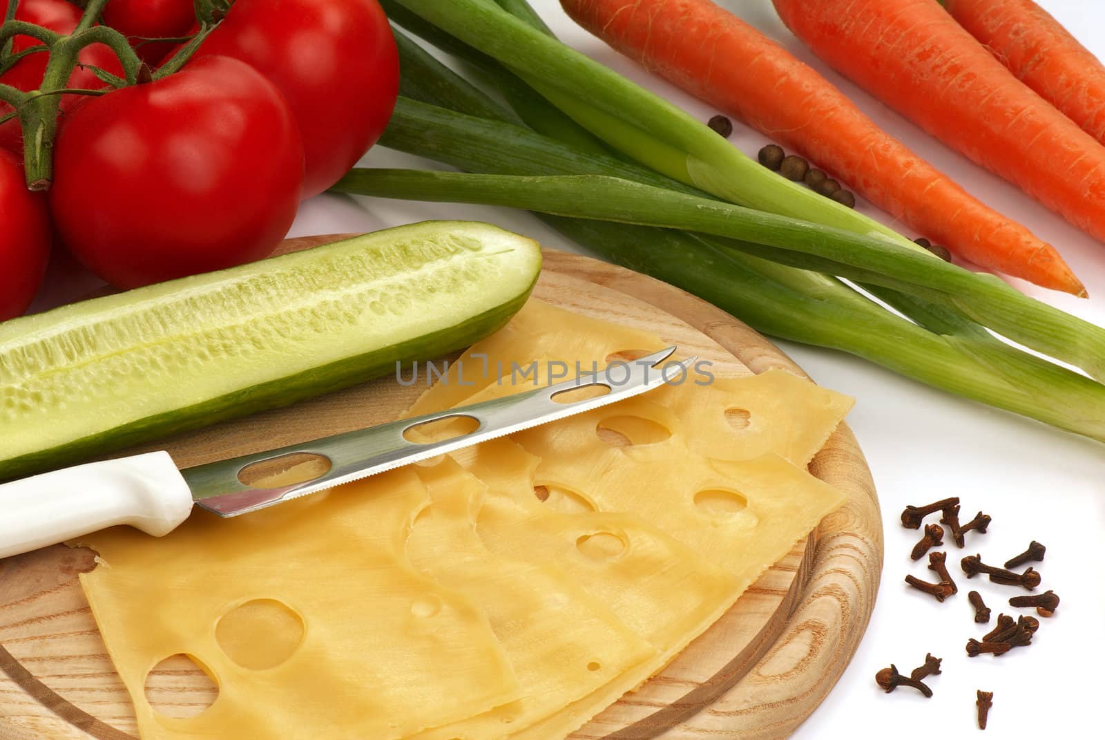 Still-life with cheese, tomatoes, carrots and seasonings