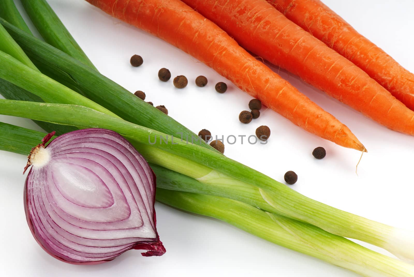 Vegetarian still-life with onion, carrots and seasonings