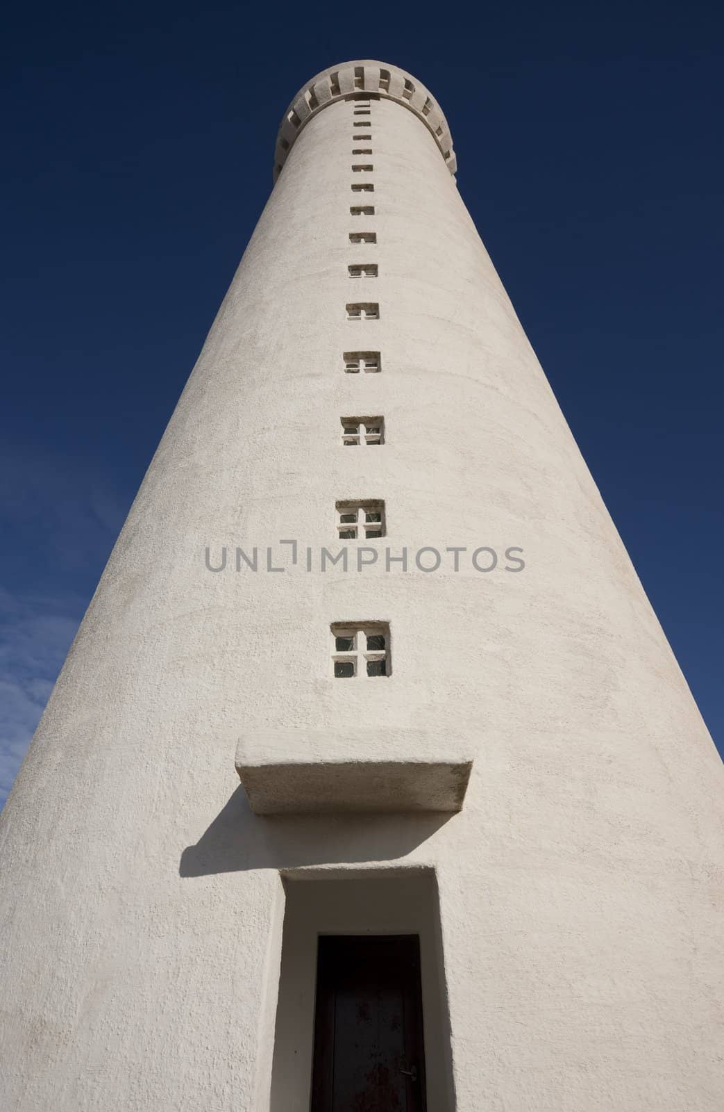 Old lighthouse on clear blue day