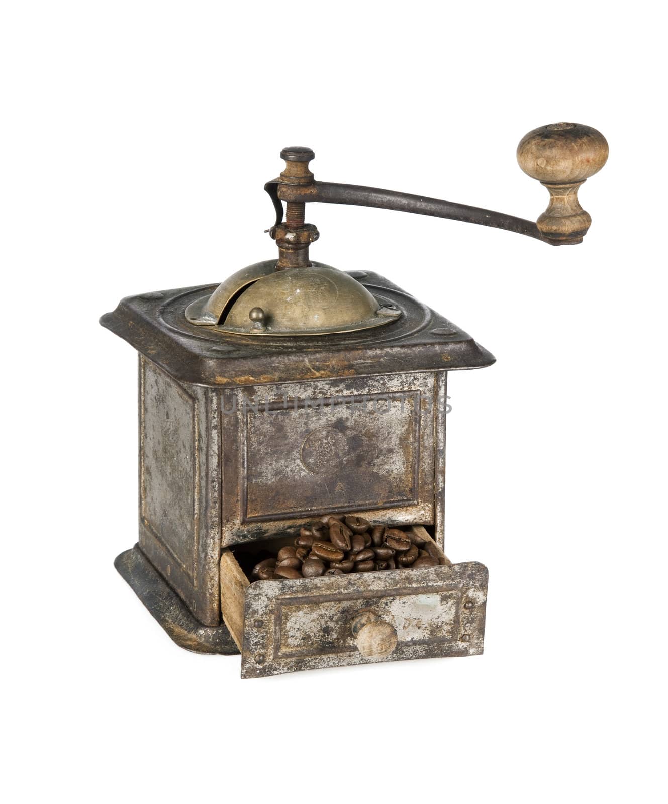 Antique coffee grinder filled with coffee beans isolated on white background