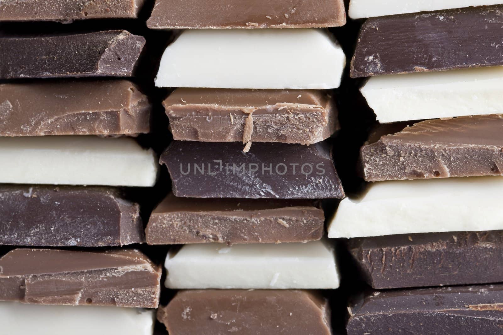 Many flavors of chocolate stacked up