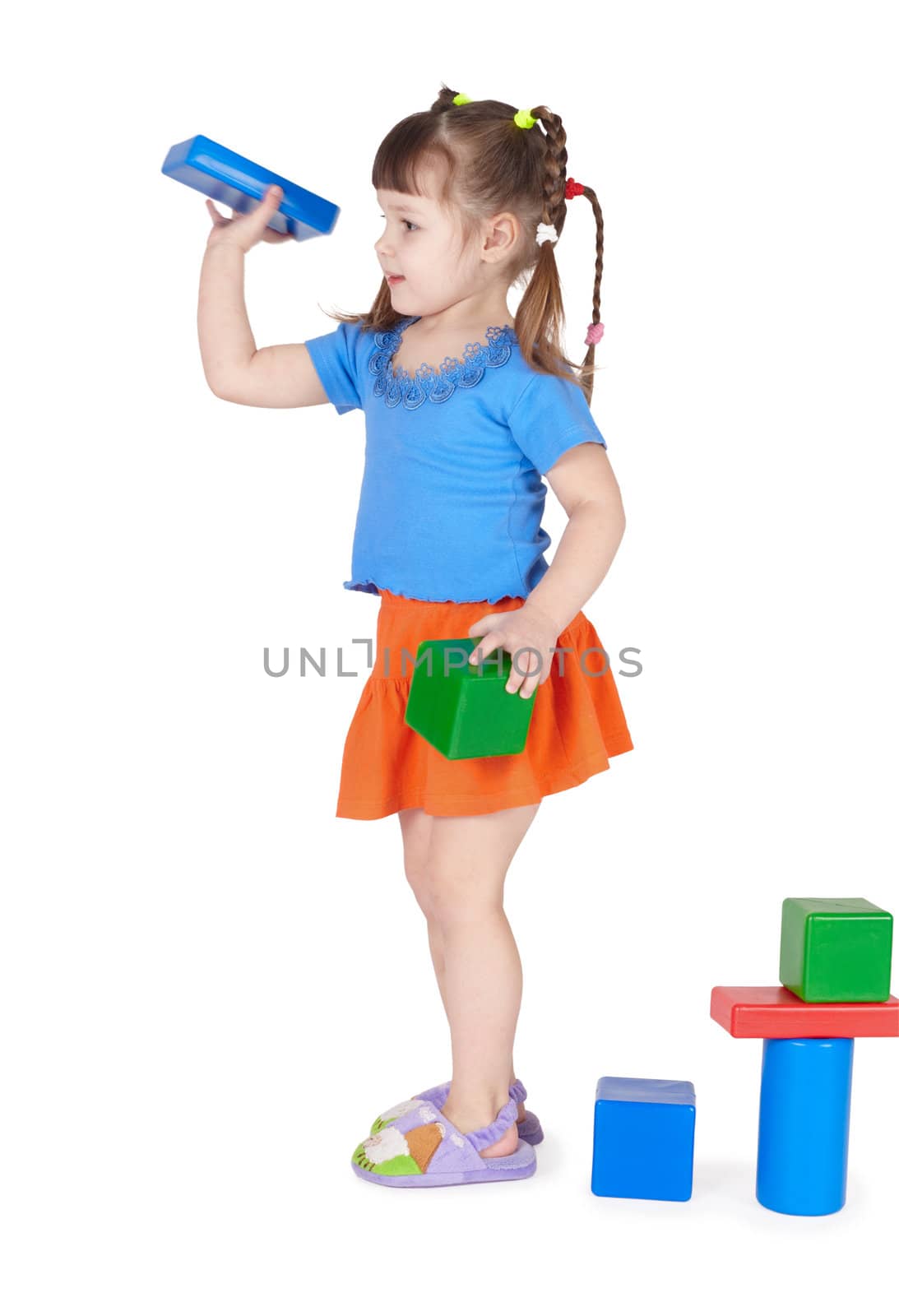 Little girl playing with toys isolated on white background