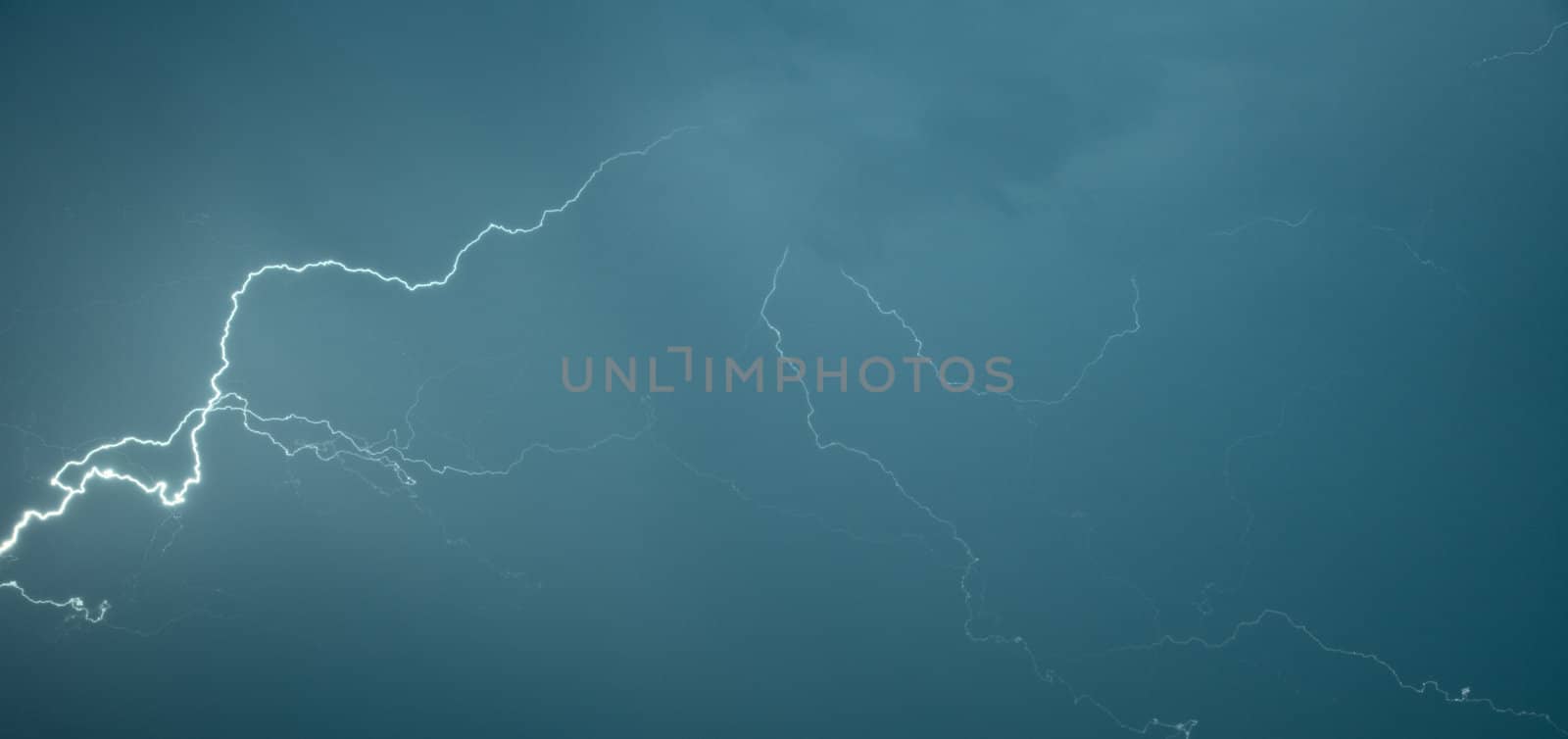 Panoramic photograph lightning flashes across the sky